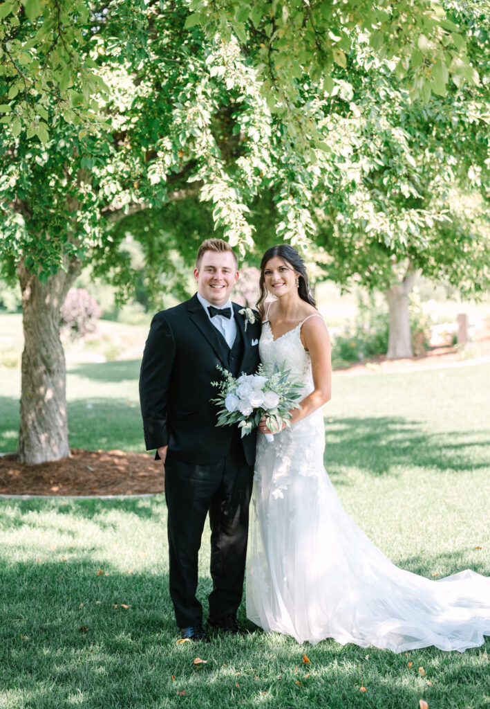 A bride and groom outside in the summer at The Union at Railside with Kelly Jo Photography