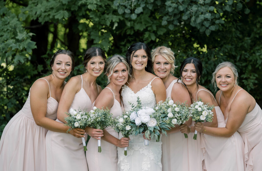 A bride and bridesmaids in pink with a Grand Rapids wedding photographer 