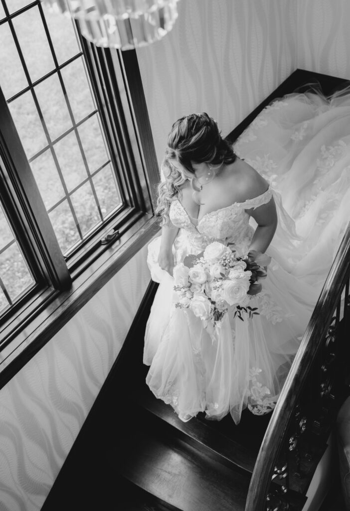 bride walking down the stairs at  Venue3Two