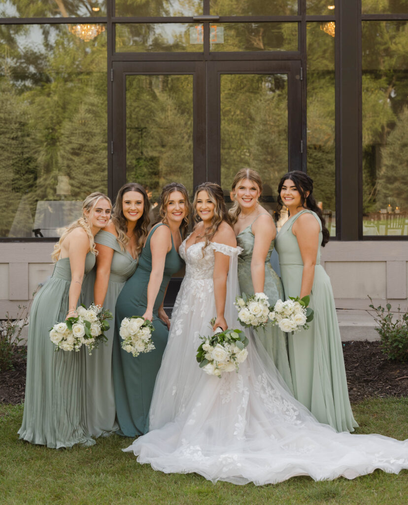 bride and bridesmaids at a wedding at Venue3Two with a Grand Rapids wedding photographer 
