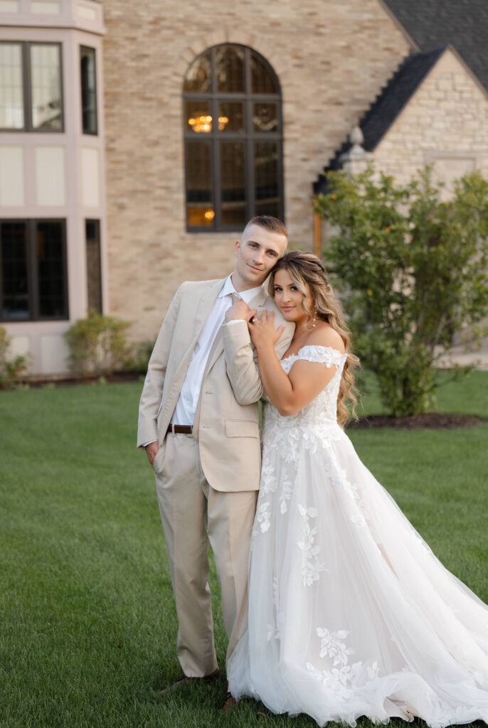 a bride and groom outside with their Michigan wedding photographer at Venue3Two