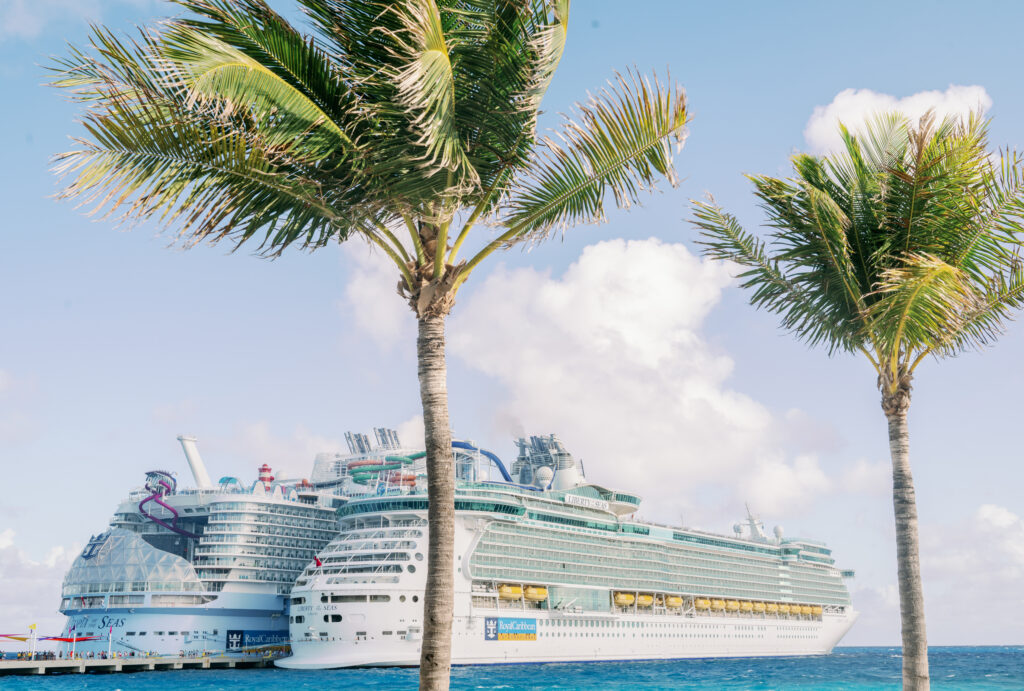 Two cruise ships docked at a port in the Bahamas